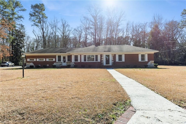 single story home with a front yard