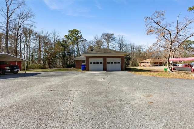 view of side of property with a garage