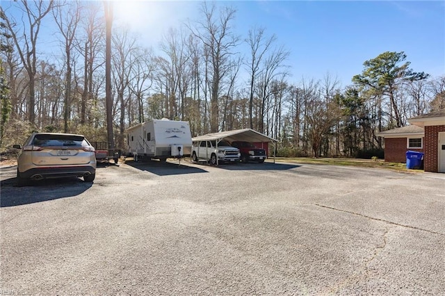 view of parking / parking lot with a carport