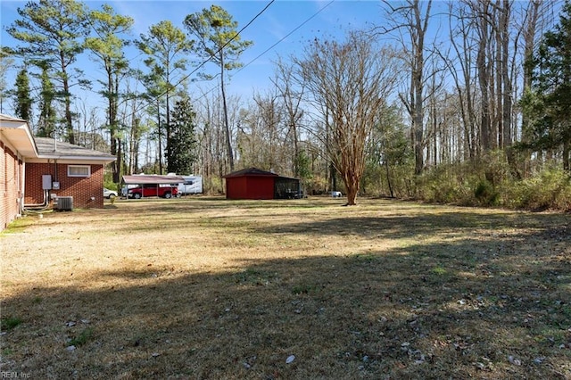 view of yard with central air condition unit