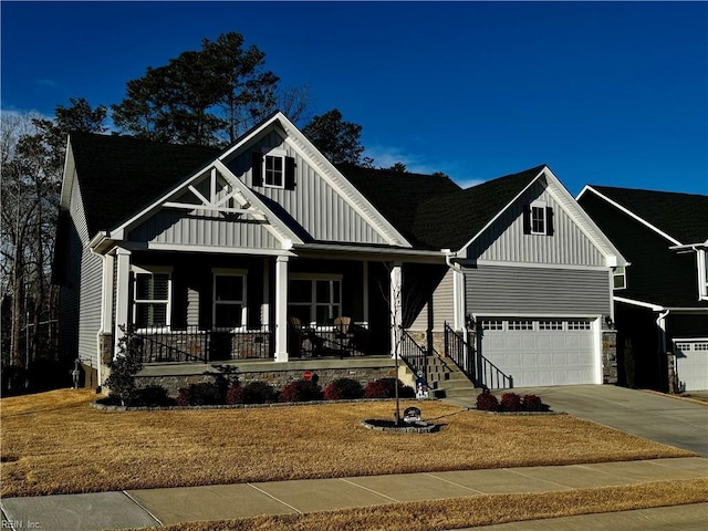 view of front of property featuring a garage and a porch