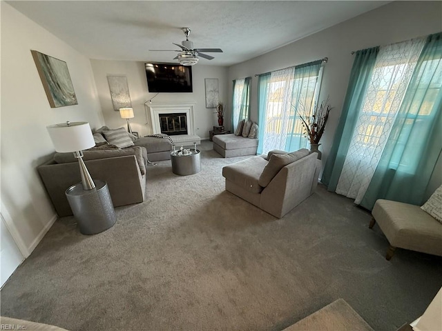 living room featuring ceiling fan and carpet flooring