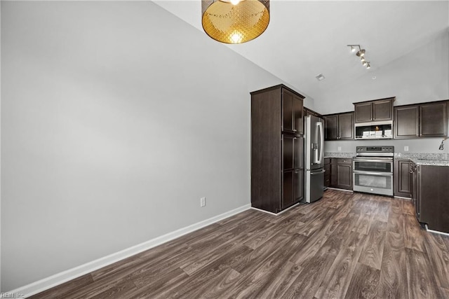 kitchen featuring appliances with stainless steel finishes, high vaulted ceiling, dark wood-type flooring, light stone counters, and dark brown cabinets