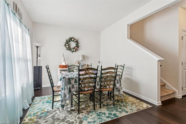 dining space featuring dark hardwood / wood-style floors