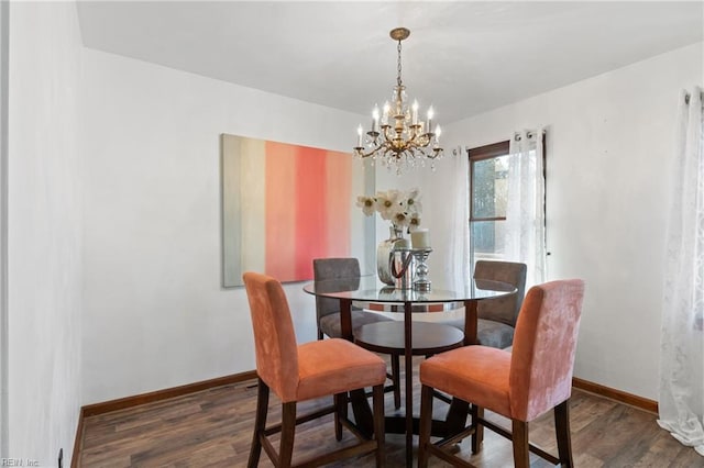 dining area featuring a chandelier and dark hardwood / wood-style flooring