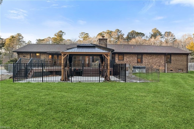 rear view of house with a yard and a patio