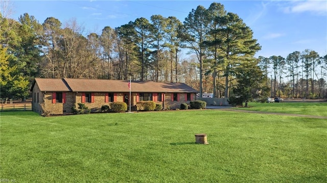 ranch-style house featuring a front lawn