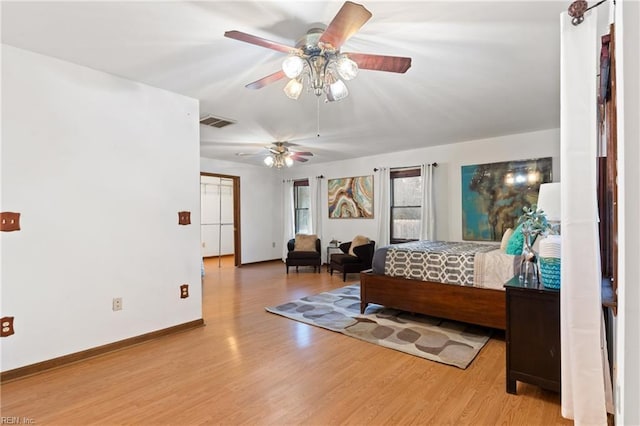 bedroom with ceiling fan and light hardwood / wood-style floors