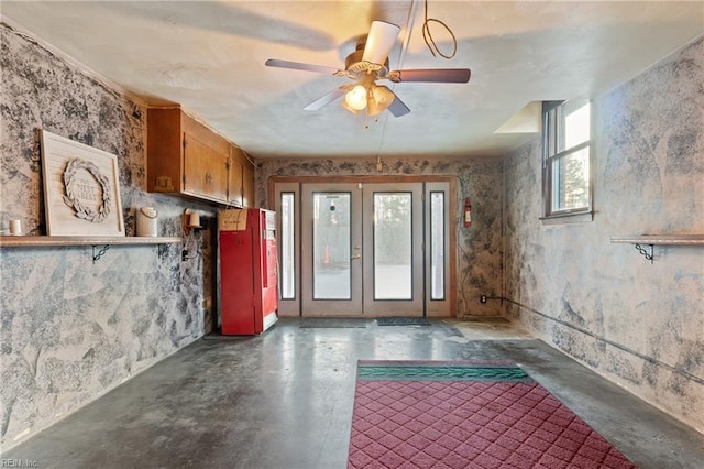 interior space featuring french doors and ceiling fan