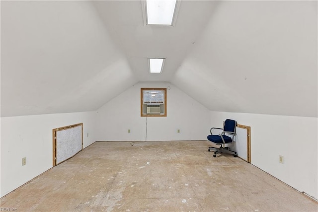 additional living space featuring cooling unit and vaulted ceiling