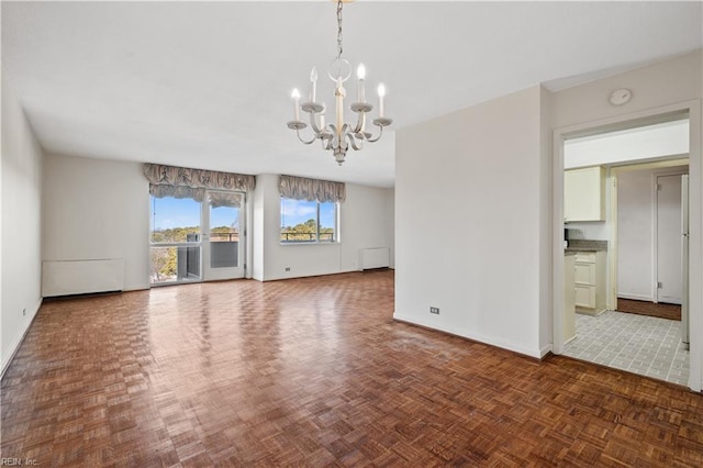 interior space with an inviting chandelier and dark parquet flooring