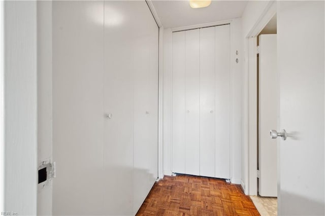 corridor featuring parquet floors