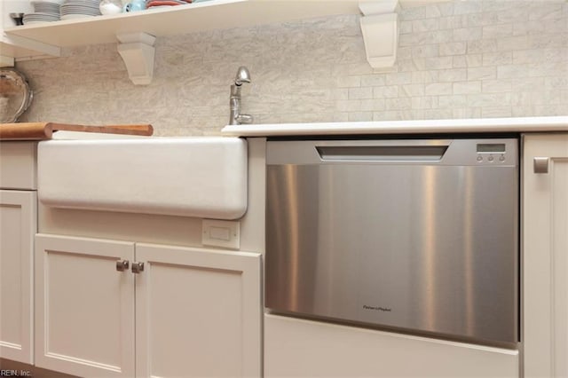 details with dishwasher, sink, white cabinets, and backsplash