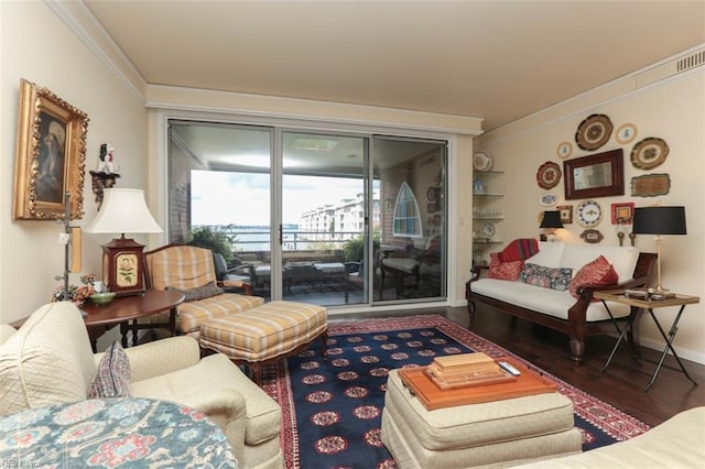 living room with ornamental molding and dark hardwood / wood-style floors