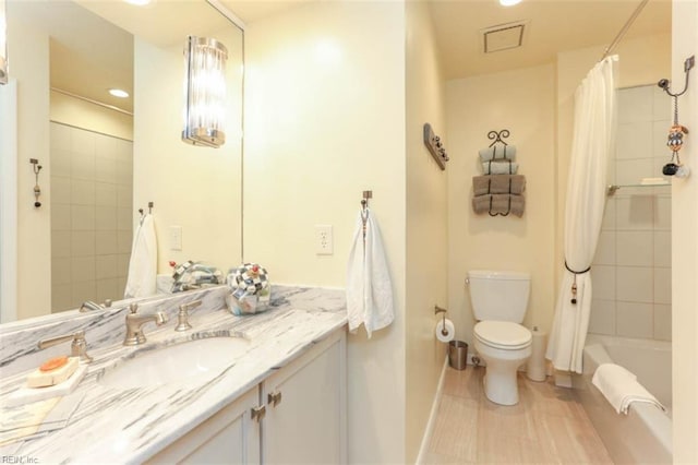 full bathroom with vanity, toilet, and shower / bath combo