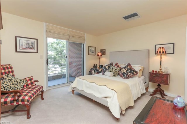 carpeted bedroom featuring access to exterior