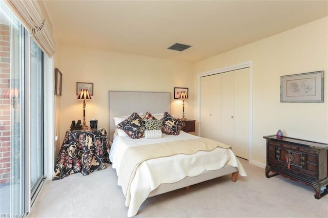 carpeted bedroom featuring a closet