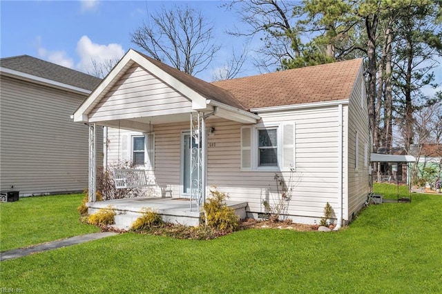 view of front of home with a front lawn and a porch