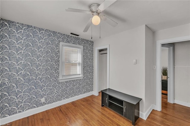 interior space with ceiling fan and light wood-type flooring