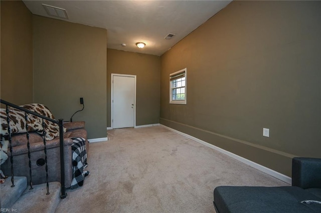 living area featuring light colored carpet