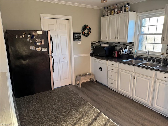 kitchen with sink, crown molding, stainless steel fridge, white dishwasher, and white cabinets