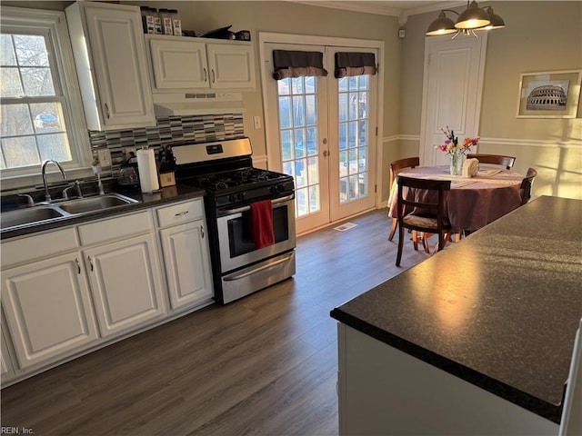 kitchen with french doors, sink, stainless steel gas range oven, white cabinetry, and dark hardwood / wood-style flooring