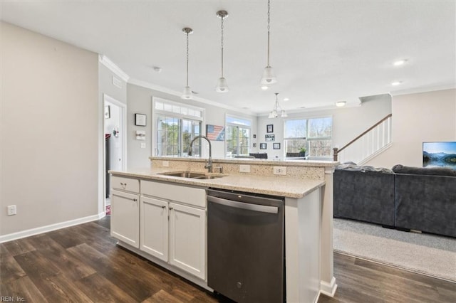 kitchen featuring sink, dishwasher, white cabinetry, a kitchen island with sink, and decorative light fixtures