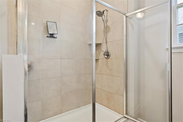 bathroom featuring an enclosed shower