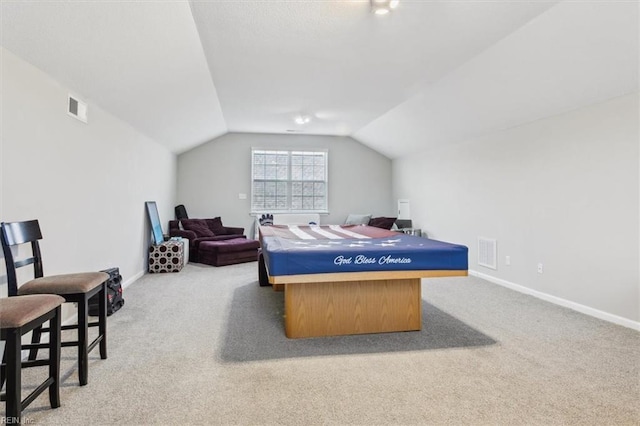 playroom with lofted ceiling and light colored carpet