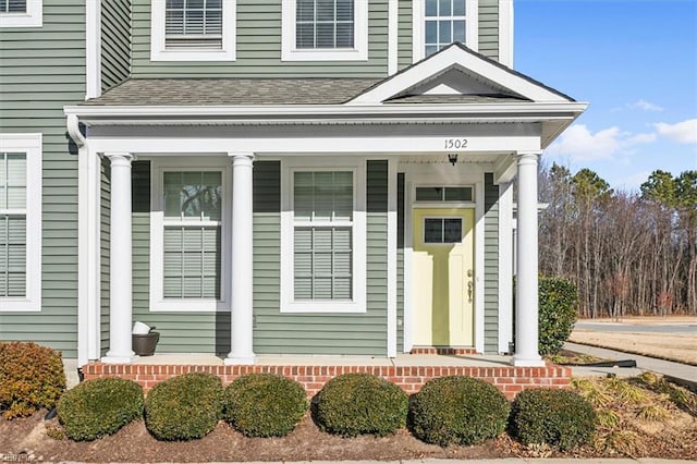 doorway to property featuring a porch