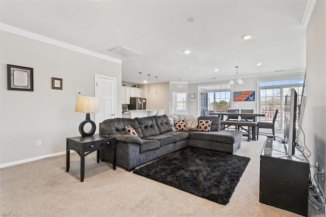 living room featuring crown molding and light carpet