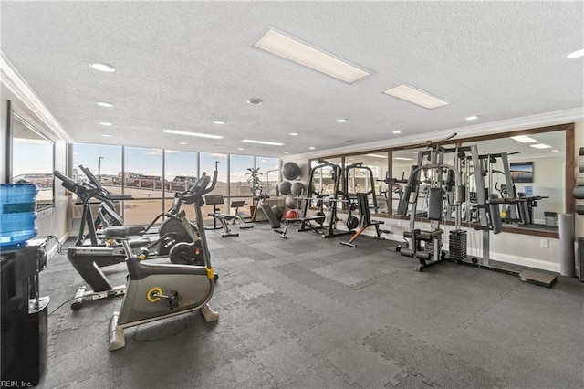 gym with ornamental molding and a textured ceiling