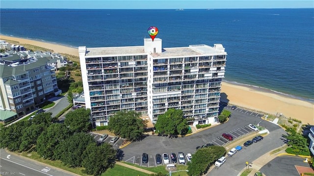 birds eye view of property featuring a view of the beach and a water view