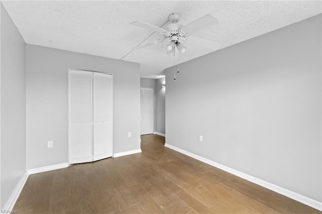 empty room featuring hardwood / wood-style floors, a textured ceiling, and ceiling fan