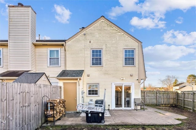 rear view of house with a patio