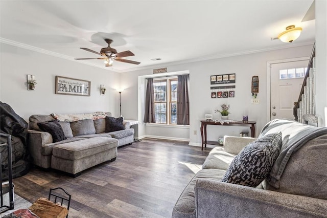 living room featuring ornamental molding, plenty of natural light, dark hardwood / wood-style floors, and ceiling fan