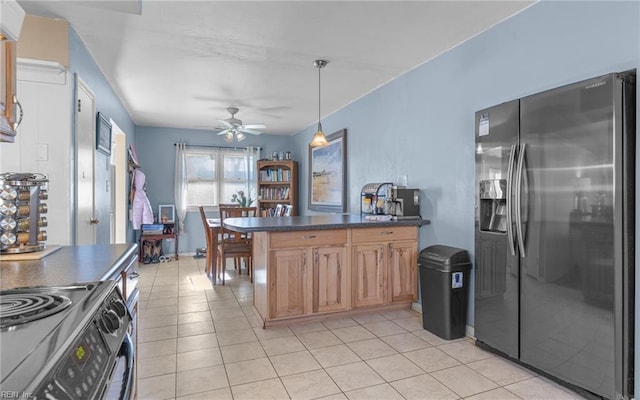 kitchen with stainless steel appliances, pendant lighting, ceiling fan, and light tile patterned floors