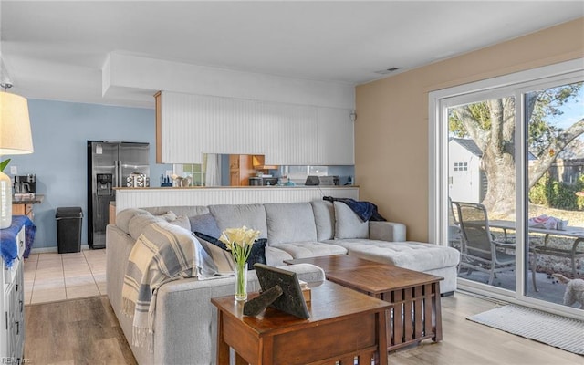 living room with light hardwood / wood-style floors