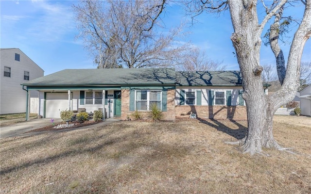 ranch-style house with a garage and a front yard