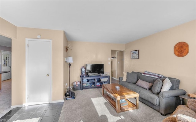 living room with dark tile patterned flooring