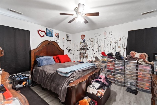 bedroom featuring hardwood / wood-style floors and ceiling fan