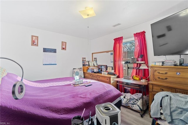 bedroom featuring light hardwood / wood-style floors