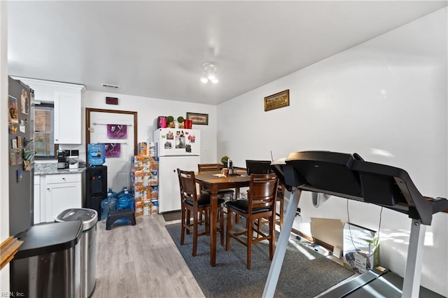 dining space featuring light hardwood / wood-style flooring