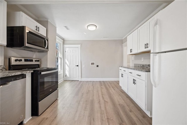 kitchen with white cabinetry, crown molding, appliances with stainless steel finishes, stone counters, and light hardwood / wood-style floors