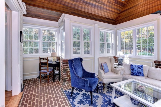 sunroom / solarium featuring vaulted ceiling and wooden ceiling