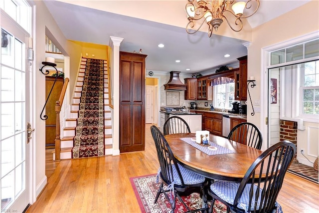 dining room featuring an inviting chandelier and light wood-type flooring