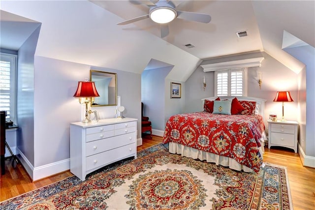 bedroom featuring vaulted ceiling, ceiling fan, and light hardwood / wood-style flooring