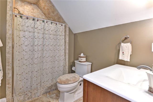 bathroom featuring walk in shower, lofted ceiling, toilet, vanity, and tile patterned flooring