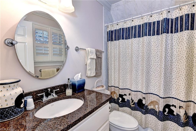 bathroom with vanity, a shower with shower curtain, and toilet