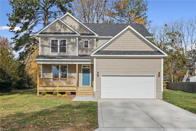 craftsman-style home with a garage, a front yard, and covered porch